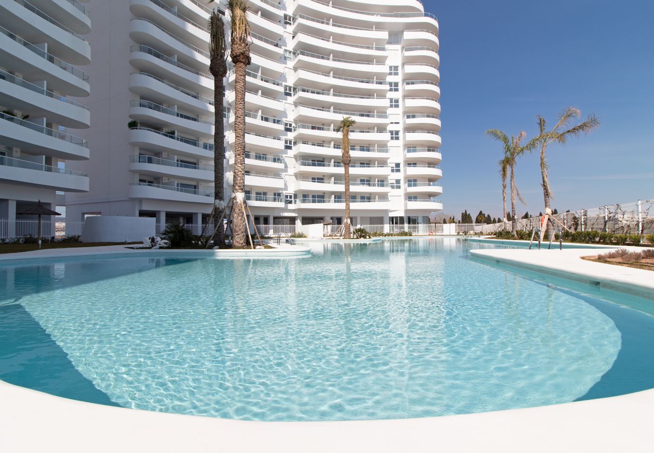 Apartamento en Canet d´en berenguer - Global Properties: Apartamento con terraza, vistas al mar y a la piscina